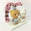 Picture of Rilakkuma wedding cake topper with Cherry Blossom Arch, Japanese Inspired Wedding Cake Decor, Sakura theme Cake Topper