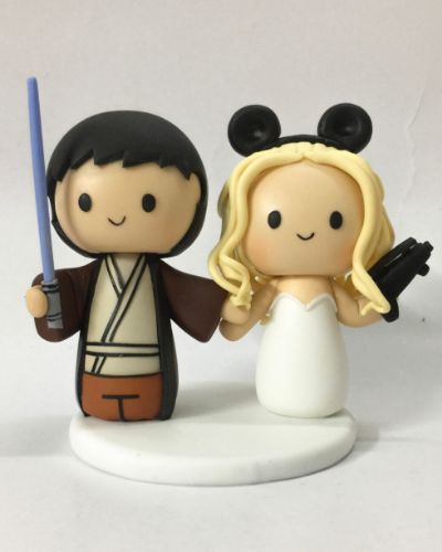 Picture of Star Wars & Mickey wedding cake topper, Bride with Blaster and Groom with Lightsaber topper