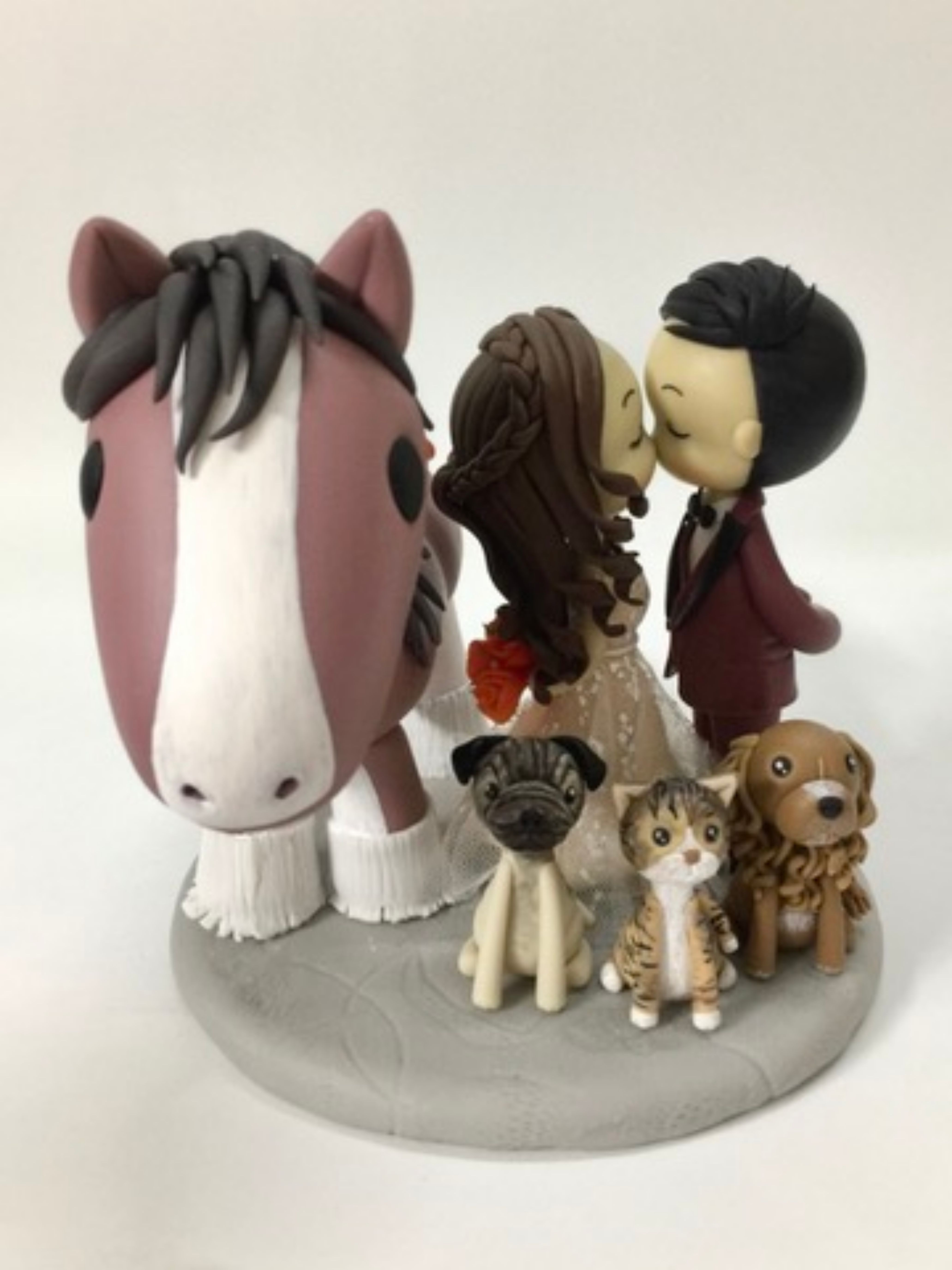 Picture of Kissing bride & groom with a horse, dogs and cat wedding cake topper, custom pet clay figurine