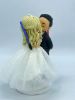 Picture of Tiny Bride & Tall Groom wedding cake topper, Bride is on Ladder kissing groom, Lightsaber Wedding Cake Topper